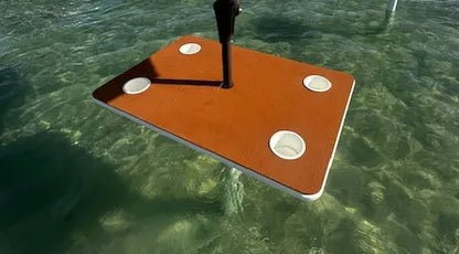 he Admiral tiki table on the water — premium coastal outdoor furniture